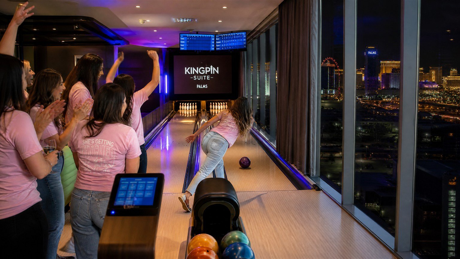 Friends bowling on private lanes inside the Kingpin Suite, one of the most famous Las Vegas themed rooms at Palms Casino Resort