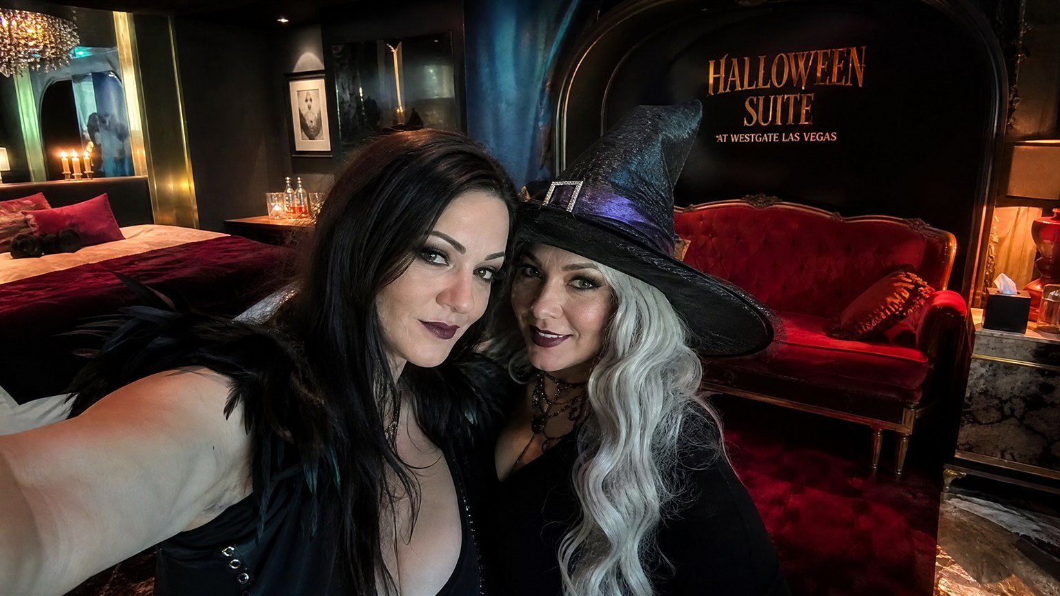 Friends in costume taking a selfie in the Halloween Suite at Westgate Las Vegas