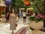 Woman walking through the flower-filled atrium at Wynn Las Vegas