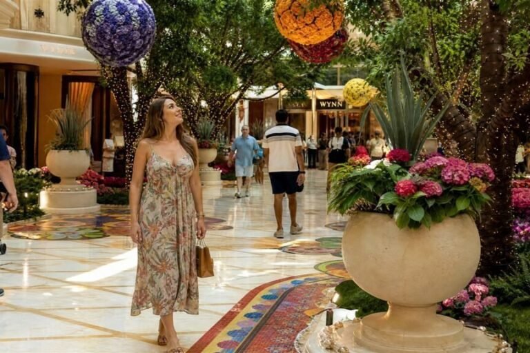 Woman walking through the flower-filled atrium at Wynn Las Vegas Woman walking through the flower-filled atrium at Wynn Las Vegas